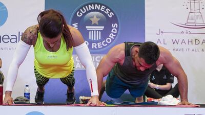 Australian mother-of-three Eva Clarke at the beginning of her knuckle push-up world record attempt on Friday. Mona Al Marzooqi / The National