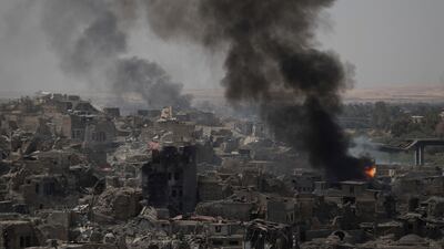 Smoke billows from Islamic State positions on the edge of the Old City a day after Iraq's prime minister declared "total victory" in Mosul