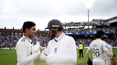 An injured Chris Woakes shakes hands with India captain Shubman Gill after the series ended 2-2. Getty Images