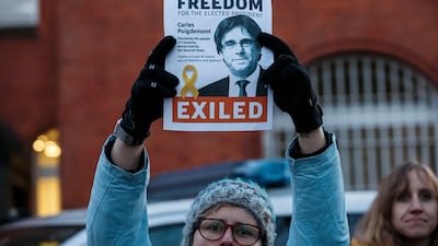 A protester outside the Nuemuenster prison where Catalan separatist leader Carles Puigedemont shows his support. Morris MacMatzen/Getty Images