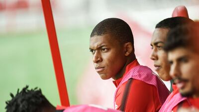 Monaco's French forward Kylian Mbappe sits on the bench during the French Ligue 1 match against Dijon on August 13, 2017 at Gaston Gerard Stadium in Dijon, northern France. Philippe Desmazes / AFP