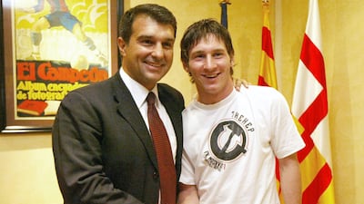 Lionel Messi, right, with Joan Laporta during the latter's first spell as Barcelona president after signing a contract extension in 2005. AFP