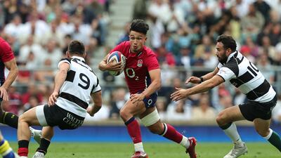 Marcus Smith of England runs with the ball during the International match against Barbarians at Twickenham on June 19, 2022 in London. Getty Images