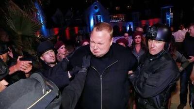 Actors in police costume mock-arrest the Megaupload founder, Kim Dotcom, in Auckland, New Zealand last week. Nigel Marple / Reuters