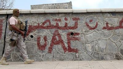 A soldier from the Saudi-led coalition walks on a street pavement in Yemen's southern port city of Aden September 27, 2015. Gulf-backed forces have been trying to help restore Yemen's internationally recognised president Abdrabu Mansur Hadi. Faisal Al Nasser/Reuters