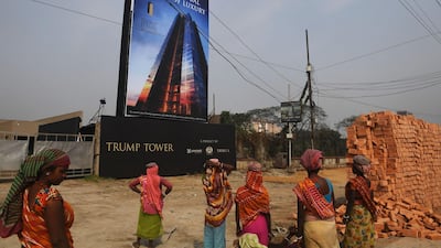 Indian labourers work on the road leading to the under-construction Trump Tower in Kolkata. Dibyangshu Sarkar / AFP