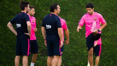 BARCELONA, SPAIN - AUGUST 17: Luis Suarez (R) in action during a FC Barcelona training session at Ciutat Esportiva on August 17, 2014 in Barcelona, Spain. (Photo by Alex Caparros/Getty Images)