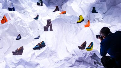 London Fashion Week was in full swing on Monday. A photographer gets a shot of shoes on display at the Roker AW22 presentation. EPA