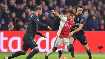 Ajax's David Neres fights for the ball with Real Madrid's Sergio Ramos. AFP