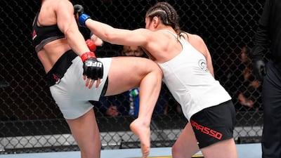 Alexa Grasso, right, of Mexico punches Maycee Barber in their flyweight fight during the UFC 258 event at UFC APEX in Las Vegas, Nevada. Jeff Bottari / Zuffa LLC / UFC