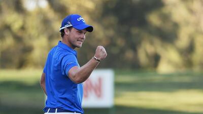 Danny Willett of England celebrates his victory on the 18th green during the final round of the Omega Dubai Desert Classic at the Emirates Golf Club on February 7, 2016 in Dubai, United Arab Emirates. (Photo by Ross Kinnaird/Getty Images)