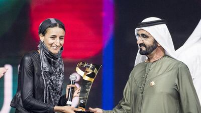 The winner of last year's Arab Hope Maker award, Nawal Al Sufi, was presented the award by Sheikh Mohammed bin Rashid, Vice President and Ruler of Dubai, for her work with refugees in Italy. Reem Mohammed / The National