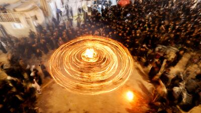 Shi'ite Muslims gather ahead of Ashura, the holiest day on the Shi'ite Muslim calendar, in Najaf, Iraq July 3, 2025. Large torches known as masha’al are lit each night during the first ten days of Muharram as part of traditional Shi'ite mourning rituals. REUTERS / Alaa al-Marjani