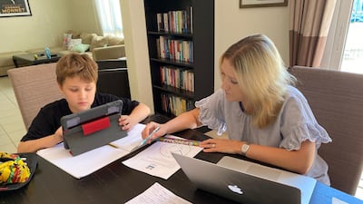Samantha Armstrong, a British parent in Dubai, helps her nine-year-old son with his e-learning. Courtesy: Samantha Armstrong