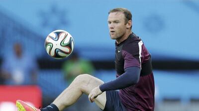Wayne Rooney shown at an England training session on Friday ahead of their World Cup 2014 opener against Italy on Saturday. Antonio Calanni / AP / June 13, 2014
