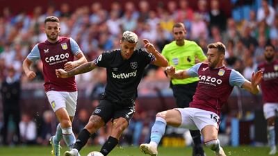 Gianluca Scamacca of West Ham United shoots whilst under pressure from Calum Chambers of Aston Villa. Getty Images