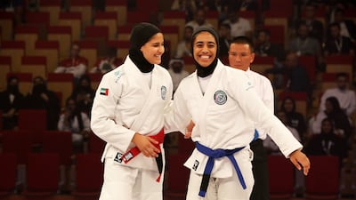UAE's Asma Al Hosani (red) beat compatriot Shamsa Al Ameri (blue) in the female 52kg final during the JJIF World Youth Championship at the Jiu-Jitsu Arena in Abu Dhabi. Pawan Singh / The National