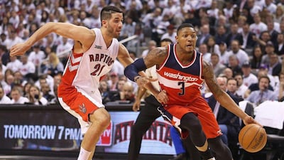 Bradley Beal of the Washington Wizards drives against Greivis Vasquez of the Toronto Raptors during their NBA play-off game on Tuesday night. Claus Andersen / Getty Images / AFP / April 21, 2015