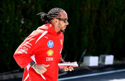 Lewis Hamilton of Ferrari walks in the paddock at Suzuka Circuit. Getty Images