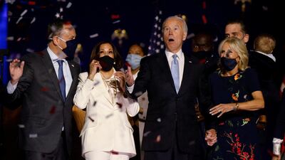 Democratic presidential nominee Joe Biden and his wife Jill, and Democratic vice presidential nominee Kamala Harris and her husband Doug, react to the confetti at their rally in Wilmington, Delaware. Reuters