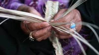 The hands of Aisha Mohammed during a weaving demonstration at the Habus tribe festival in Ras al Khaimah. Older women in the tribe are finding their traditional handicrafts in demand.