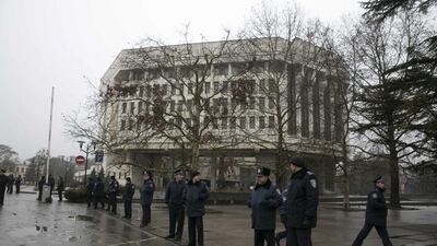Ukrainian police stand guard in front the Crimean parliament building in Simferopol. Armed men seized the regional government headquarters and parliament on Ukraine's Crimea peninsula on Thursday and raised the Russian flag. Reuters