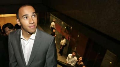 McLaren Formula One driver Lewis Hamilton arrives for a promotional event at a shopping mall in Singapore today. Earlier, an F1 appeal court rejected McLaren's bid to reinstate him as the winner of the Belgian GP.