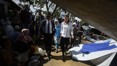 Jordan's Queen Rania walks past Rohingya refugees during her visit to the Kutupalong refugee camp in Ukhia. Tauseef Mustafa / AFP