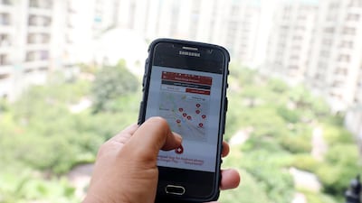 A woman in New Delhi uses her phone. Samsung is to set up a plant to double its phone making capacity in India. EPA