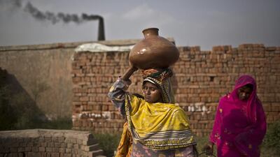 Pakistani women carry water after collecting it from a well on the outskirts of Islamabad, Pakistan. Pakistanis are facing a shortage of clean drinking water due to the low level of water in the country’s dams. Muhammed Muheisen / AP
