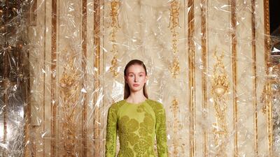 A sculpted bias green sleeved gown