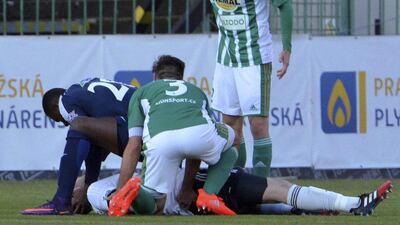 The moment Francis Kone rushes to help Martin Berkovec after the goalkeeper swalloed his tongue following a collision with a teammate. bohemians.cz via AP