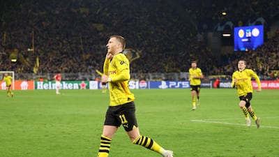 Marco Reus celebrates after scoring Dortmund's second goal in the Champions League match against PSV. EPA