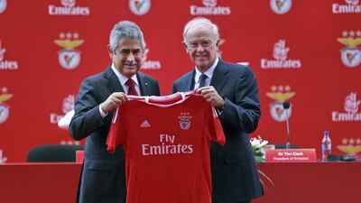 Emirates president Tim Clark, right, and Benfica’s president Luis Filipe Vieira present a Benfica jersey reading Fly Emirates after signing the three-year sponsorship agreement in Lisbon, Portugal. Miguel Lopes / EPA