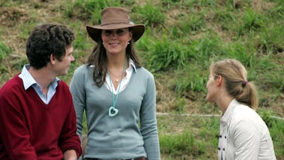 Kate Middleton chats with friends at the Gatcombe Park Festival in England in 2005. Getty Images