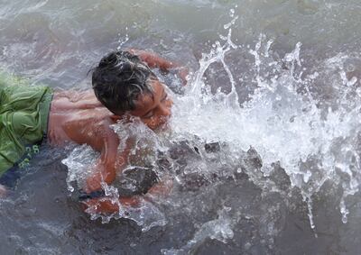 A boy bathes in the river Ganges in India. Reuters
