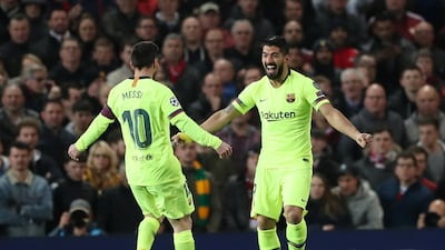 Barcelona's Luis Suarez celebrates scoring their first goal with Lionel Messi. Reuters