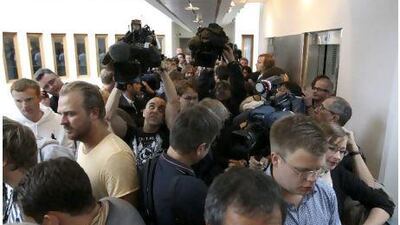Journalists queue outside the courtroom where Anders Behring Breivik, the man accused of a killing spree and bomb attack, was due to appear yesterday. Fabrizio Bensch / Reuters