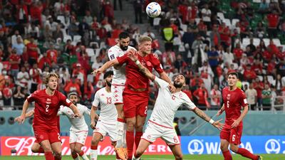 Denmark forward Andreas Cornelius heads the ball during the match. AFP