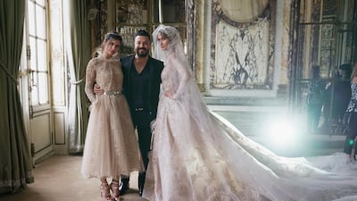 Zuhair Murad poses with models prior to his Haute Couture autumn/winter 2017-2018 show during Paris Fashion Week. Photo by Vittorio Zunino Celotto / Getty Images