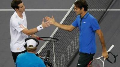 Andy Murray, left, has had the upper hand over Roger Federer overall, but not in a major slam. Lintao Zhang / Getty Images