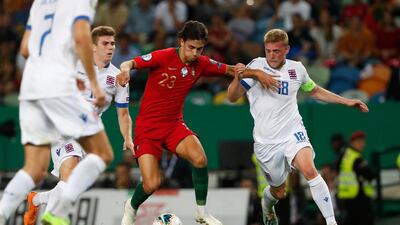 Portugal's Joao Felix, second from right, challenges for the ball with Luxembourg's Florian Bohnert, second from left, and Luxembourg's Laurent Jans, right, during the Euro 2020 group B qualifying soccer match between Portugal and Luxembourg at the Jose Alvalade stadium in Lisbon. AP Photo
