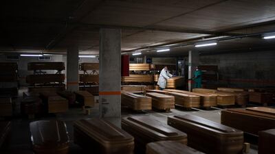 Coffins carrying the bodies of people who died of coronavirus are stored waiting to be buried or incinerated in an underground parking lot at the Collserola funeral home in Barcelona, Spain, April 2, 2020. AP