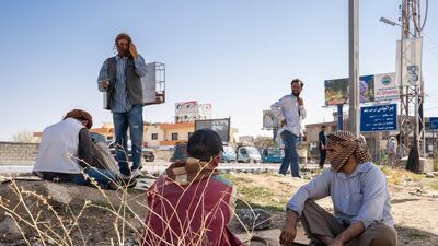 Syrians in Beqaa, hit by Lebanon's economic crisis, wait to be hired as handymen for the day. Thibault Lefébure for The National