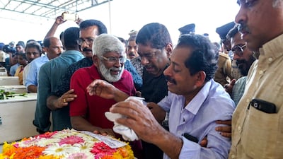 Relatives mourn the deceased. AFP