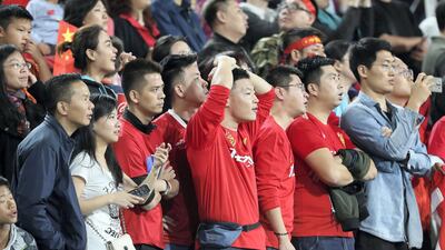 China supporters watch during their Asian Cup quarter-final match against Iran at Mohammed bin Zayed Stadium in Abu Dhabi.