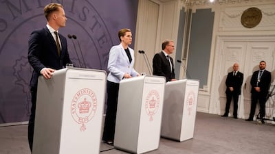 Danish Prime Minister Mette Frederiksen, centre, Danish Foreign Minister Jeppe Kofod, left, and Danish Defence Minister Morten Boedskov discuss allowing US troops on Danish soil. AFP