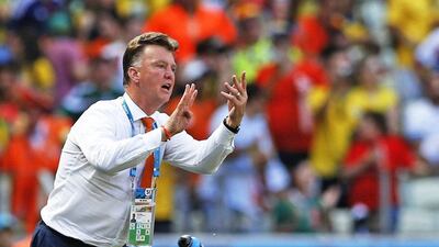 Louis van gaal gestures instructions to his team during the Netherlands' win over Mexico on Sunday at the 2014 World Cup in Fortaleza, Brazil. Julio Munoz / EPA / June 29, 2014