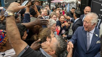 On Wednesday, Prince Charles shook hands and posed for selfies with members of the public in Walworth in south London during a visit to JD Sports shop. AFP