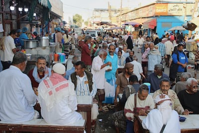 People eat at a restaurant in the southern Yemeni city of Aden. AP